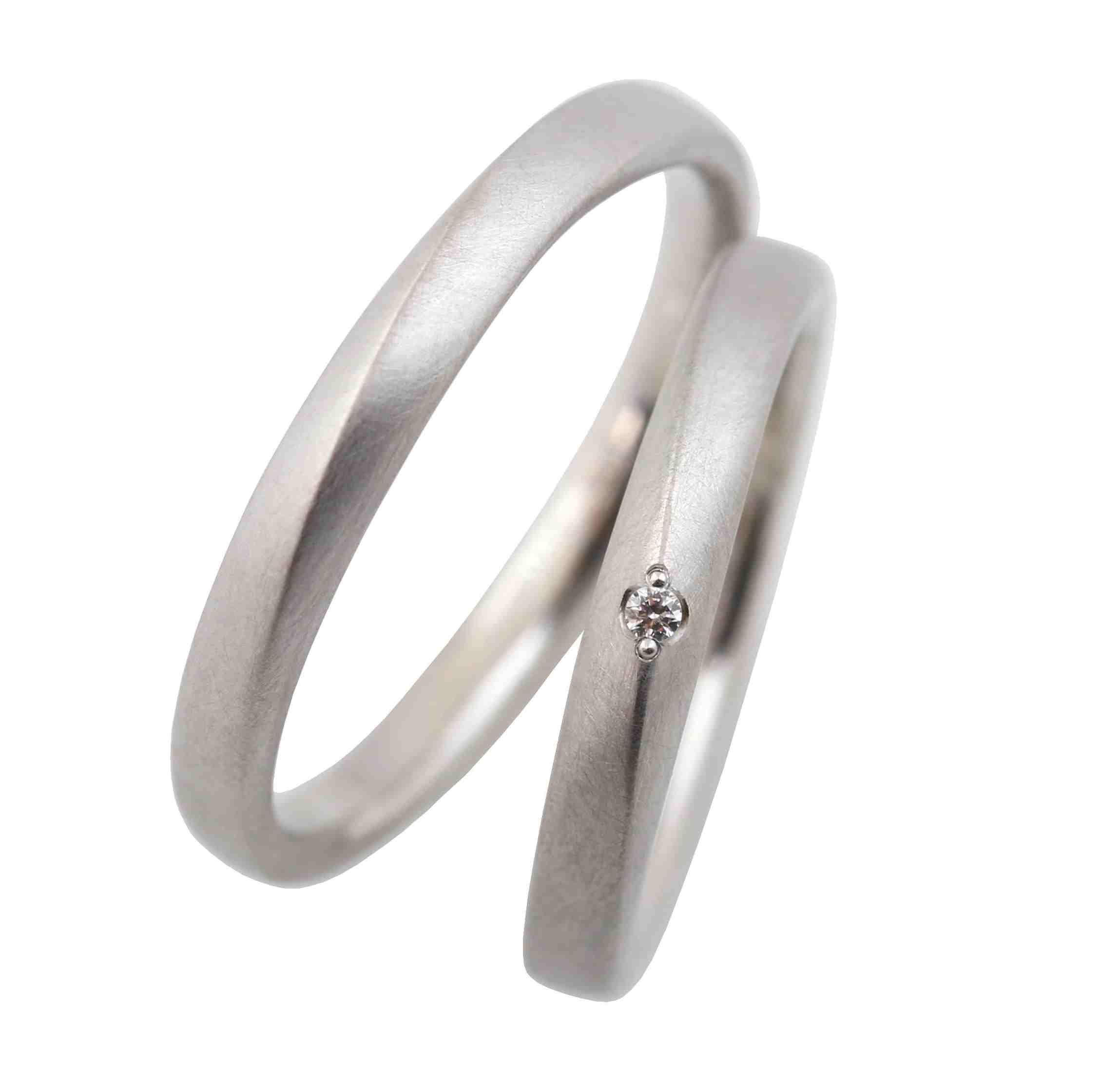 Processing:
Rolled, sawed, matte, polished, milled, stamped
Surface finish:
Matte, polished inside
Materials:
950 platinum
Notable feature:
Elegant rings whose side surfaces become the main surface, creating a beautiful line
Shape:
Band ring, square profile
Category:
Friendship ring, wedding ring, partner ring, engagement ring
Style:
Modern, individual design
Ring width:
3mm
Material thickness:
2mm
Enchanting wedding rings, friendship rings, or engagement rings made of platinum with a diamond. The previously incidental side surfaces become the main surface and merge into an almost imperceptible line. The rings are each 3mm wide. The material thickness is 2mm. The rings have a matte finish, with a polished inside. The edges are pleasantly rounded for a comfortable fit. They are sustainably produced and 100% made in Germany. The diamond is sourced from conflict-free origins.